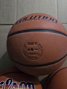 Wilson Orange Basketball with Black Ribbing
